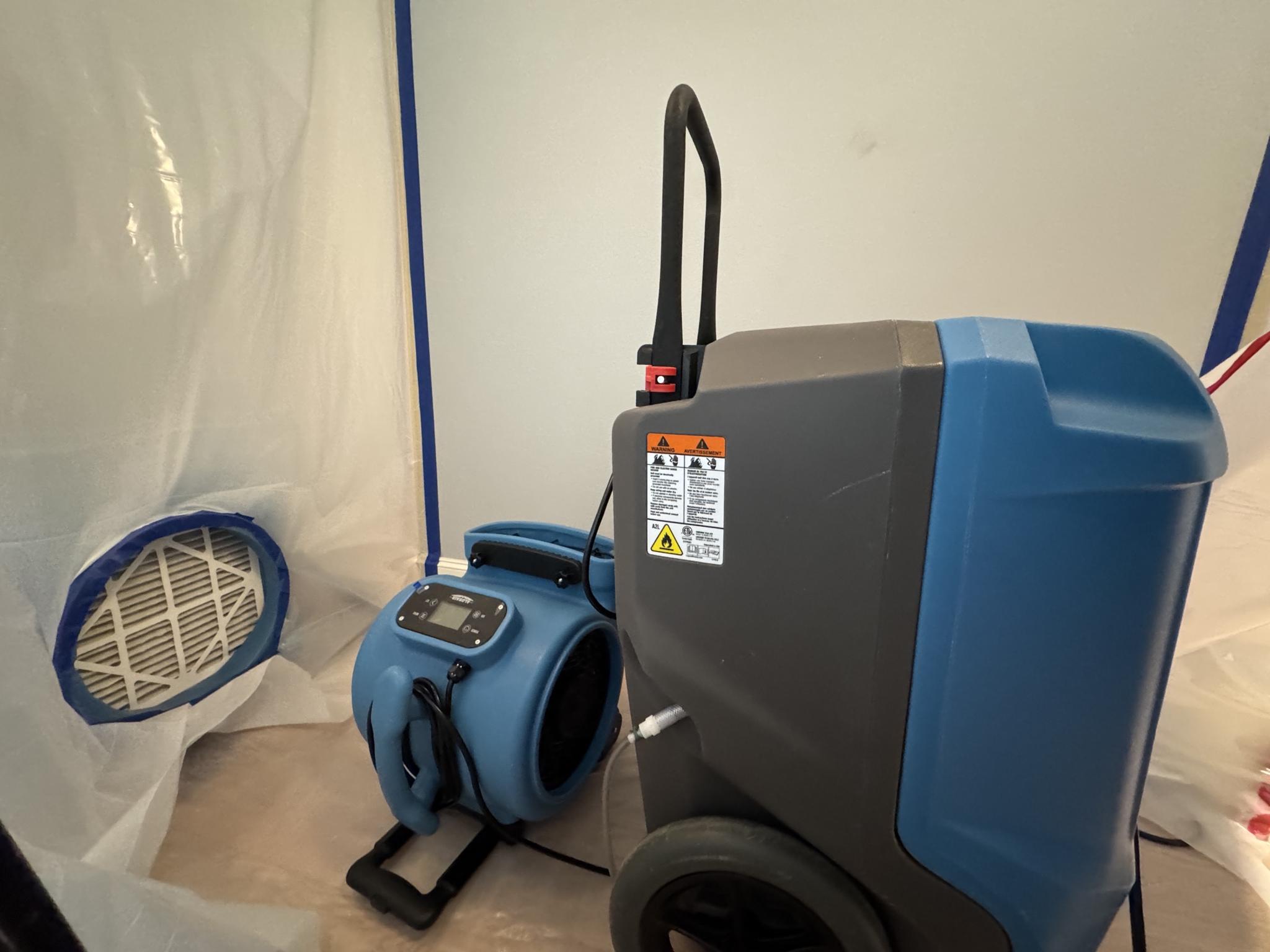 Commercial-grade desiccant dehumidifier and air scrubber on a St. Charles County job