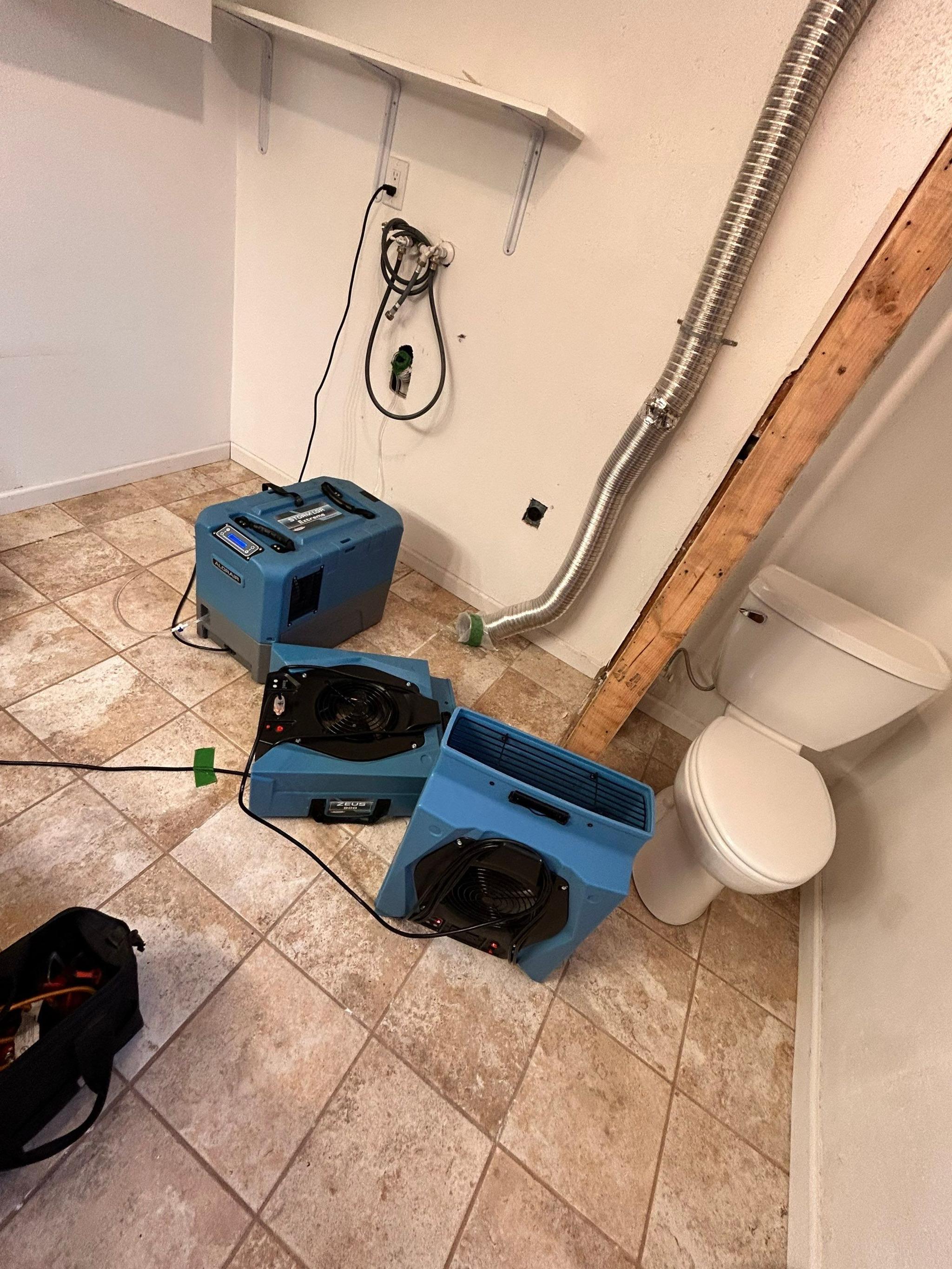 Water damage restoration equipment drying a home in Maryland Heights, Missouri